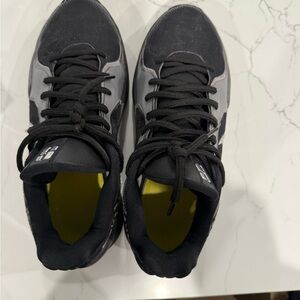 Woman’s Nike Sabrina Black and Gray Athletic Nike  Sneaker